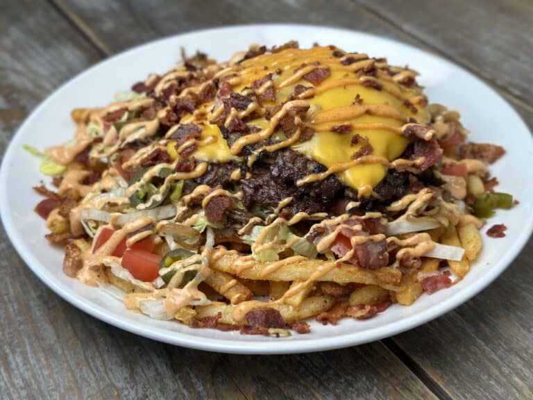 bacon cheeseburger loaded fries on a plate
