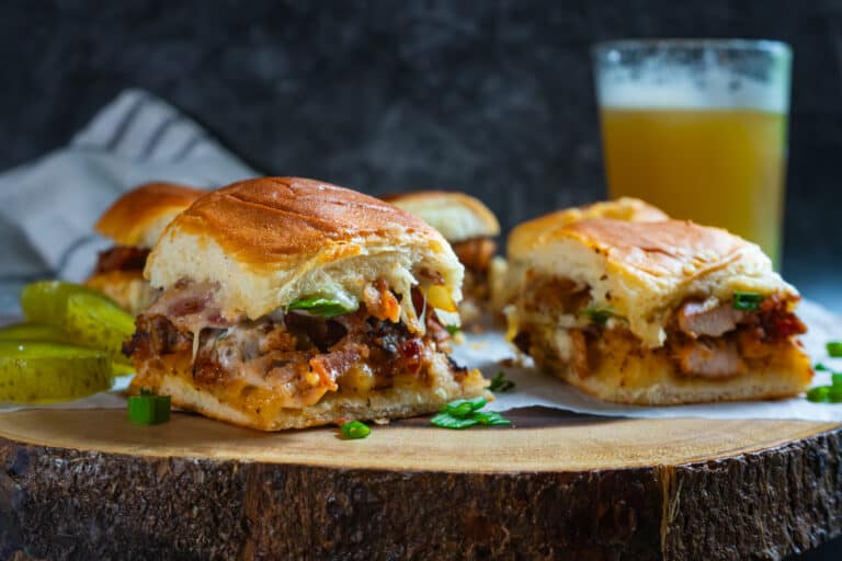 Chicken bacon ranch sliders being served with beer.