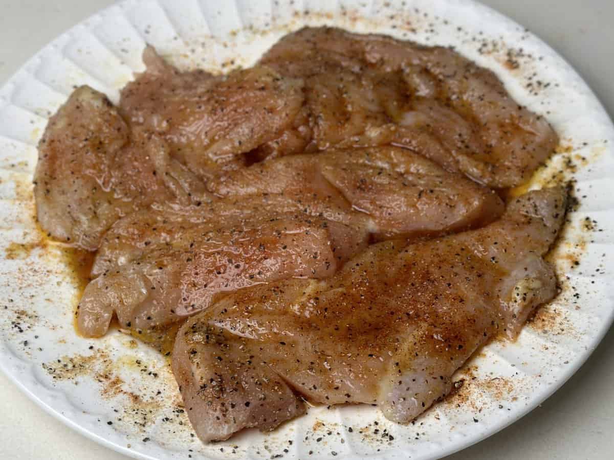 chicken seasoned on a plate