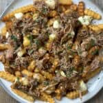 Smoked Pulled Pork Poutine on a plate.