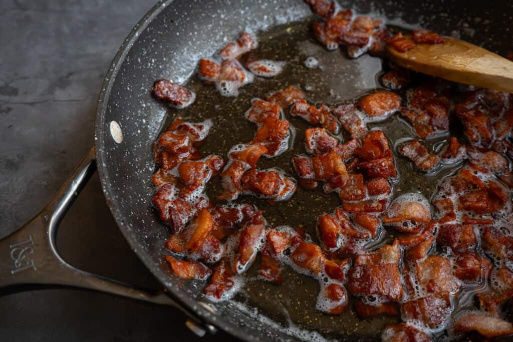 Bacon cooked in a frying pan