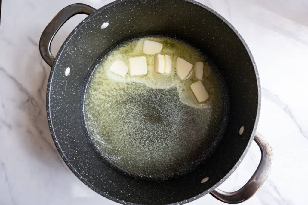 butter melted in a pan for Mac and cheese