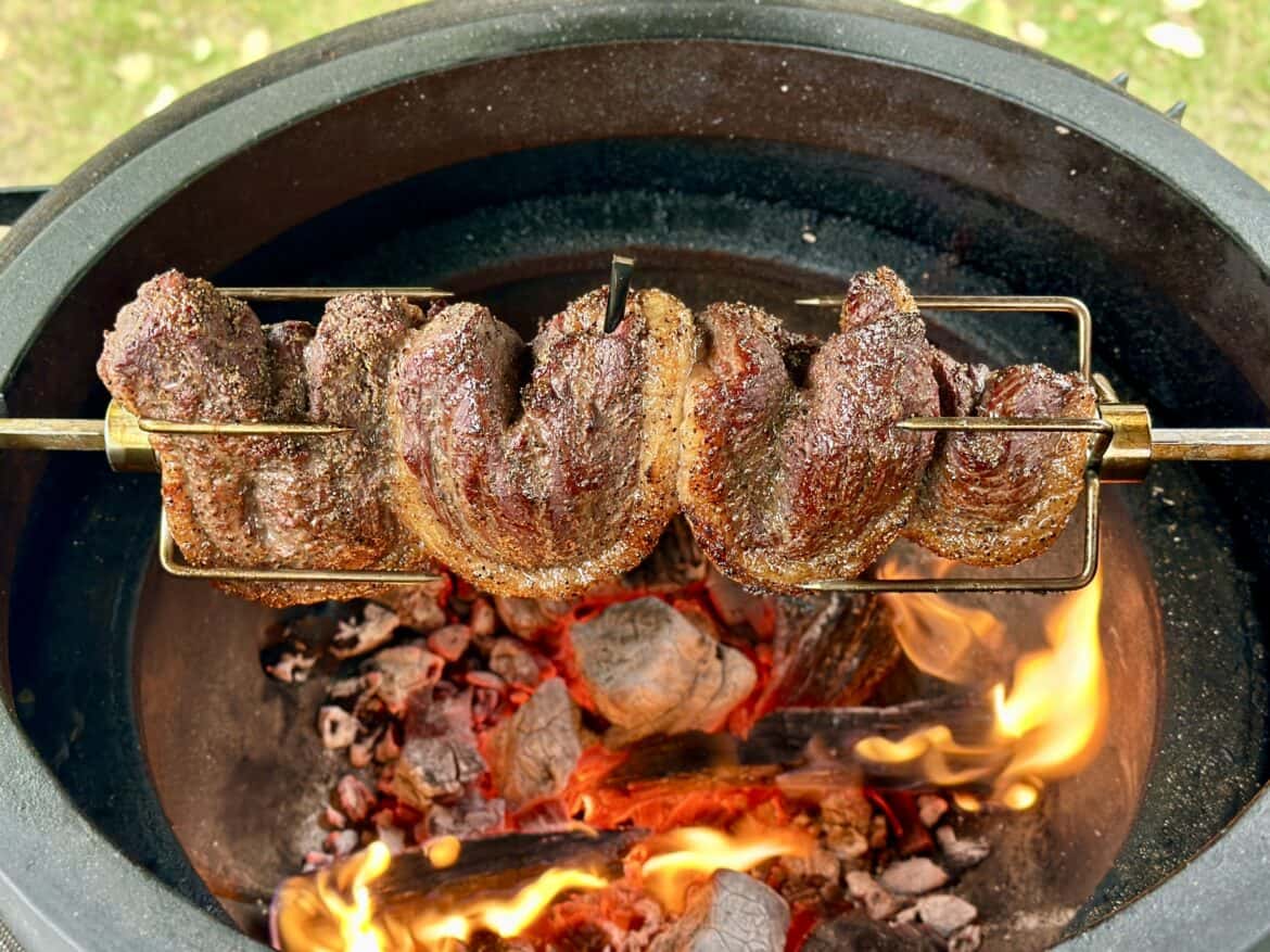 wagyu piranha cooking over fire