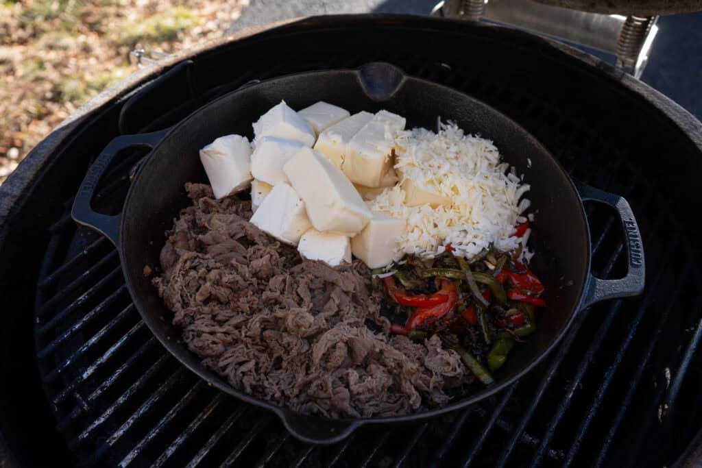 Philly cheesesteak queso on the smoker.