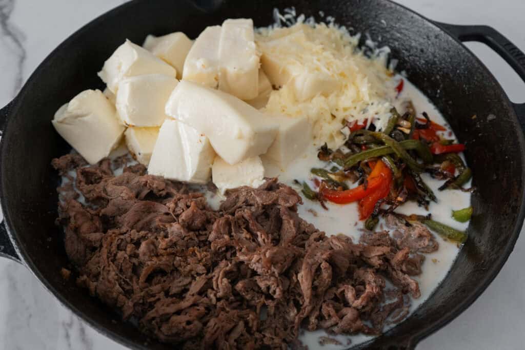 Philly cheesesteak queso ingredients.