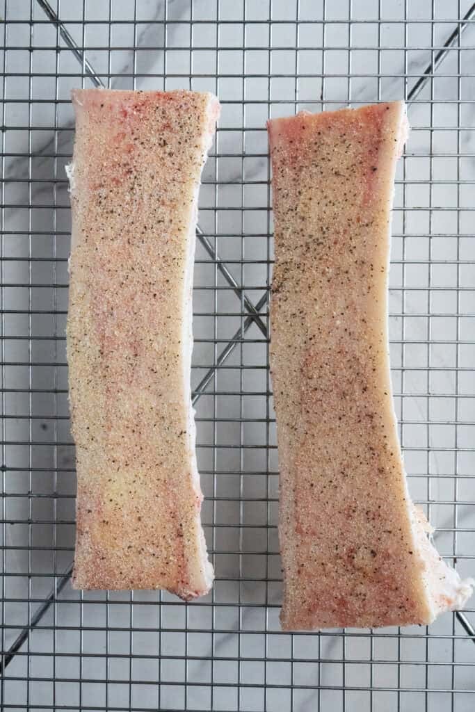 Bone marrow seasoned with salt and pepper.
