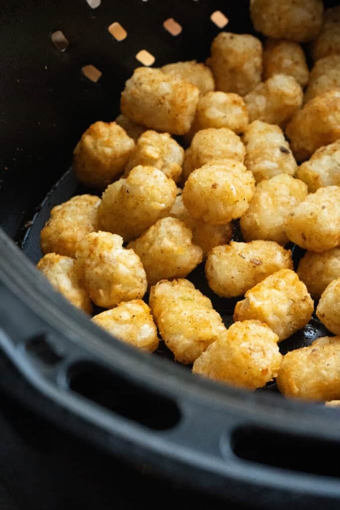 Tater tots in an air fryer.