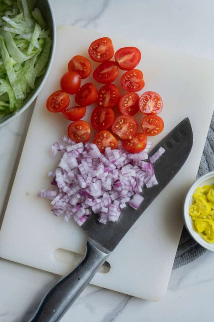 Sliced vegetables on a cutting board.