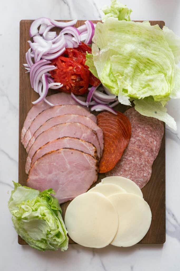 Chopped Italian Sandwich ingredients on a cutting board.