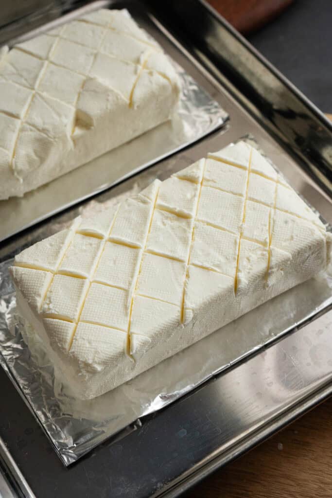 Cream cheese scored in a cross hatch pattern.
