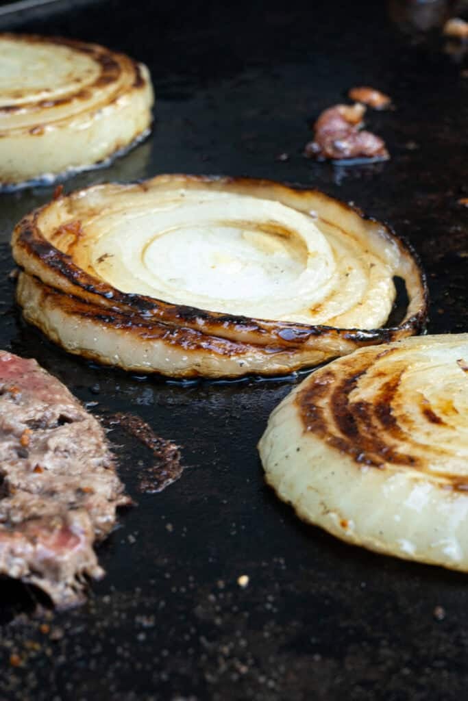 Onions cooking on the griddle.