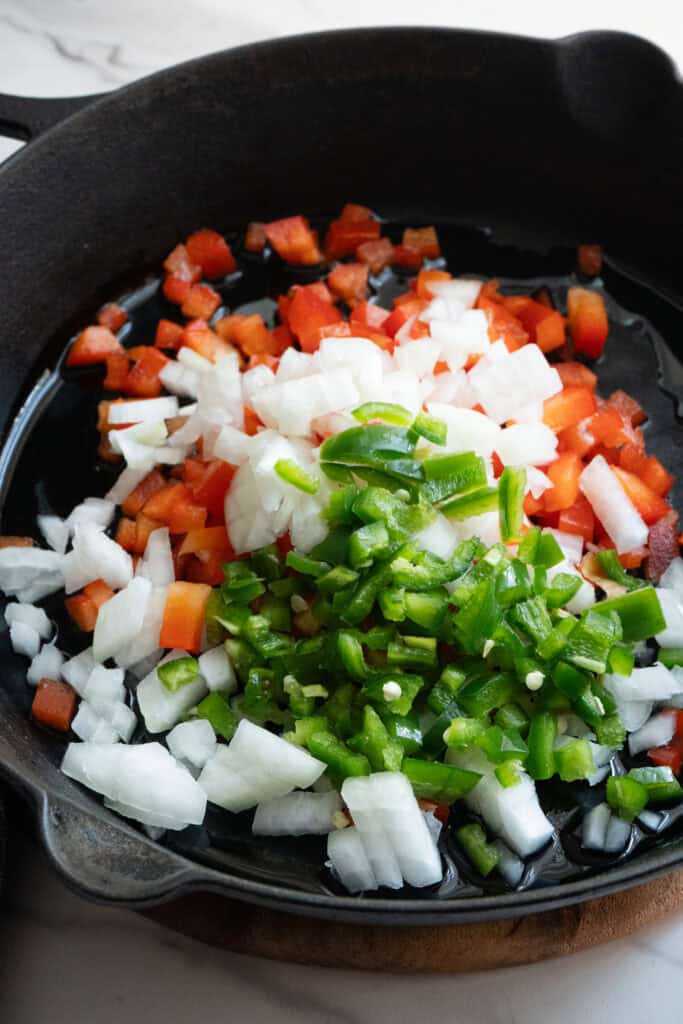Sautéed vegetables for steak and corn dip.