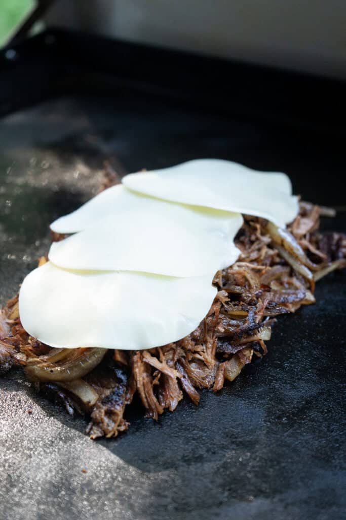 Provolone cheese on Smoked Brisket Cheesesteaks.