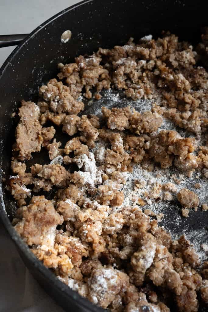 Sausage cooking with flour.