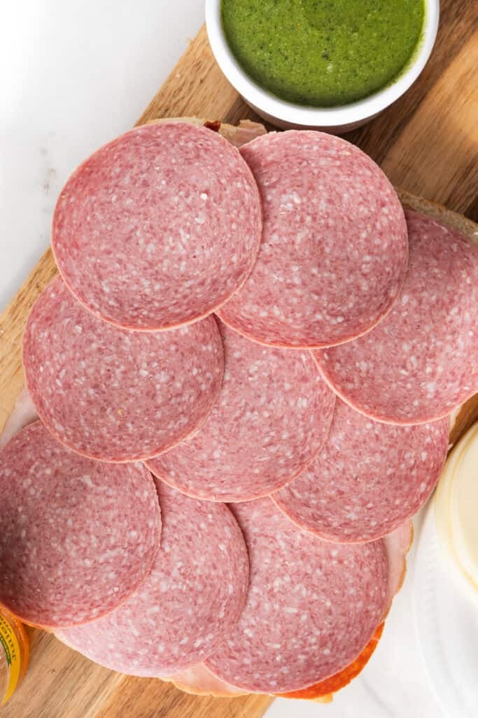 Salami on Italian pesto sliders.