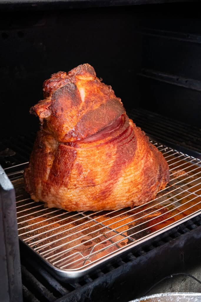 Pineapple Bourbon Glazed Ham on the smoker.