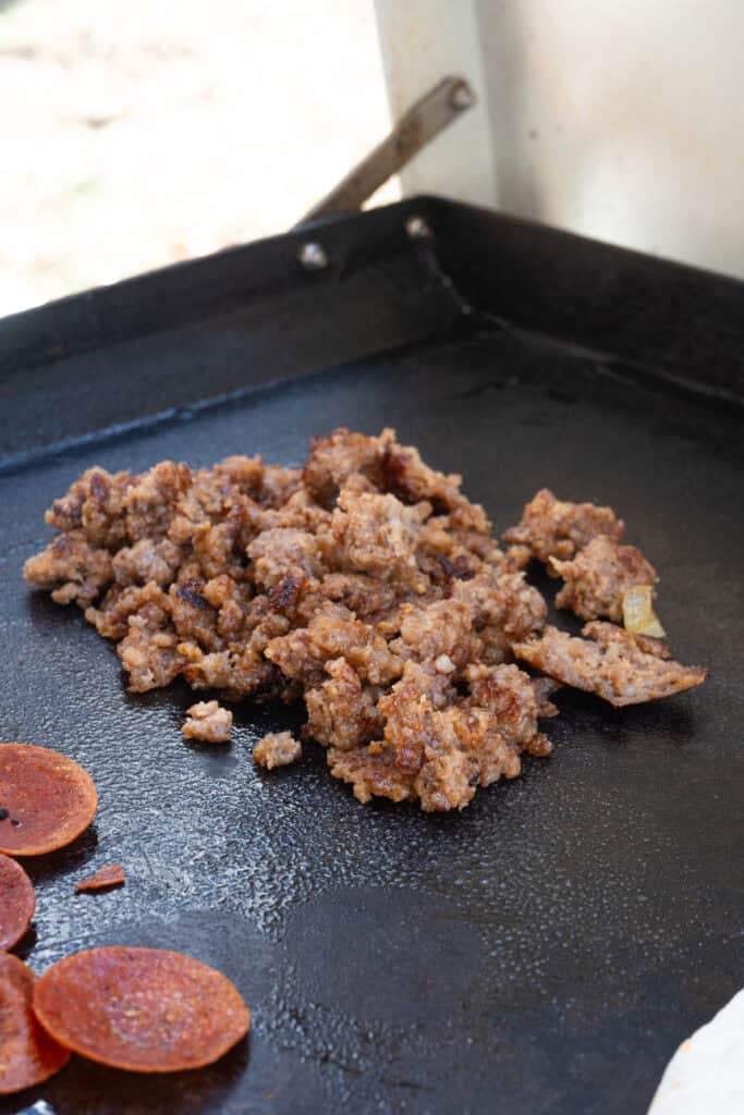 cooked sausage for pizza quesadillas.