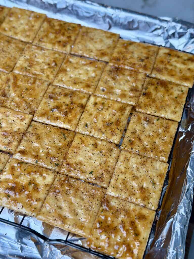 Smoked BBQ Saltine Crackers on a wire rack.