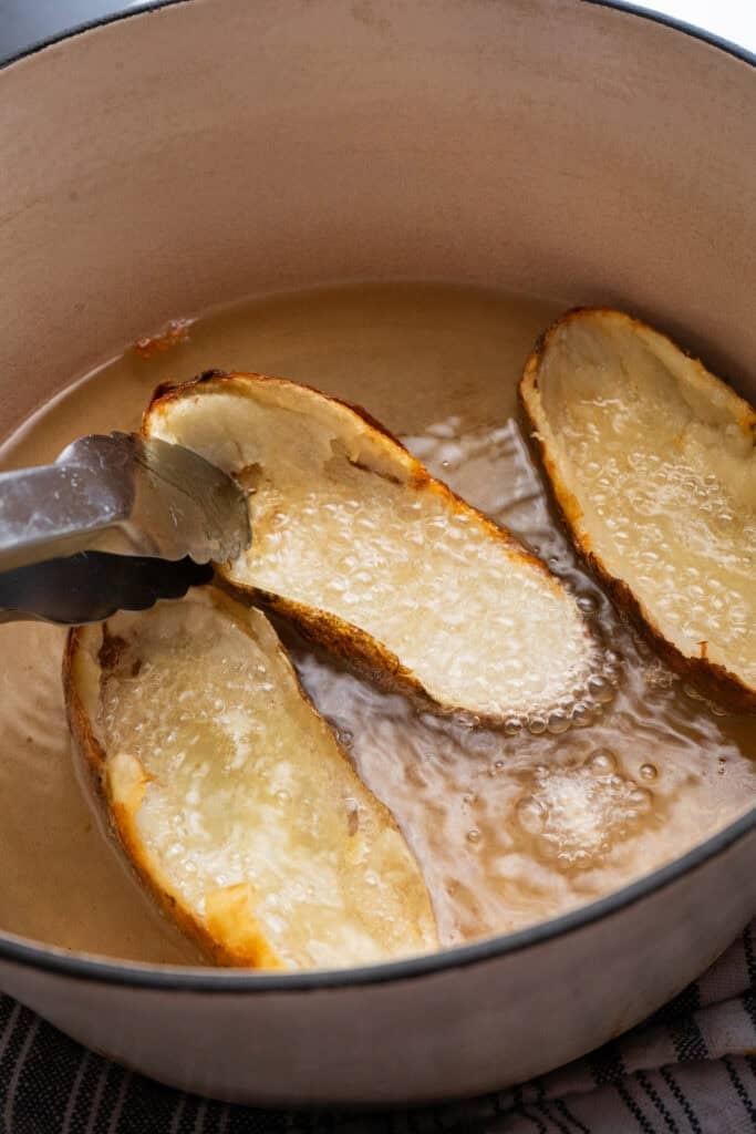 potato skins frying in hot oil.