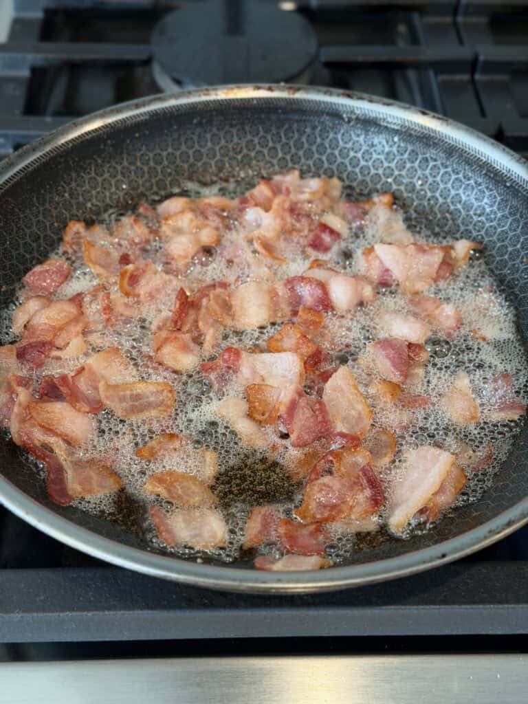 Bacon cooking in pan.