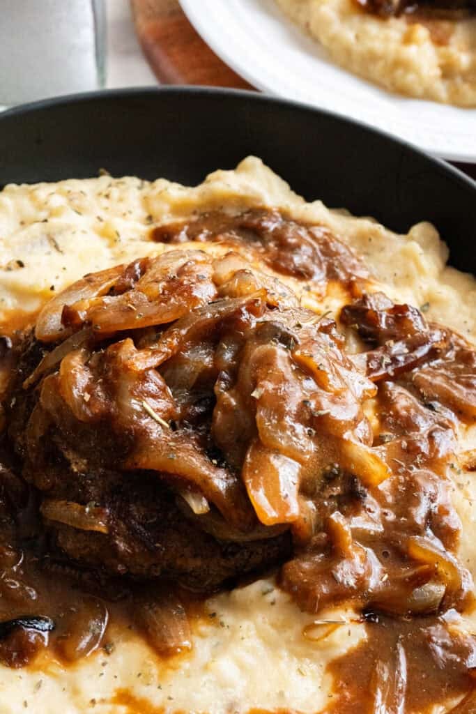 Hamburger Steaks on mashed potatoes.