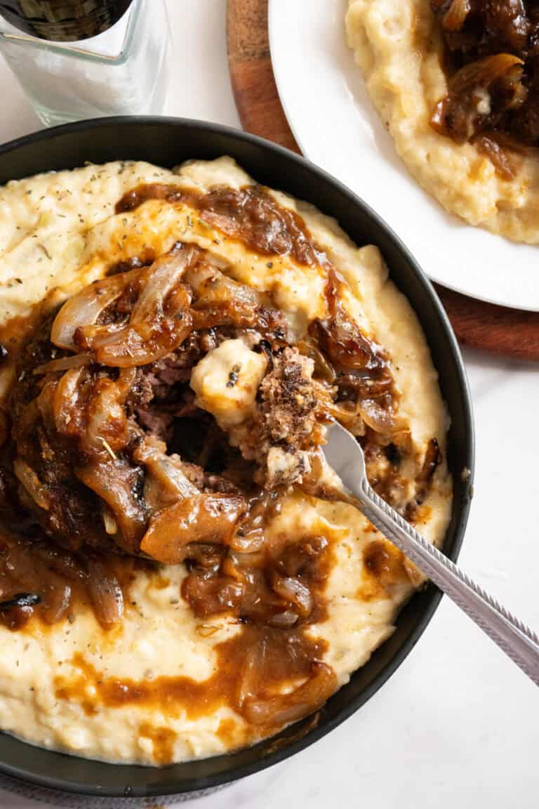 Hamburger Steaks on mashed Potatoes.