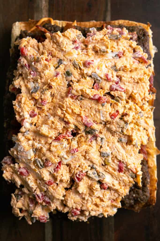 Pimento Cheese Spread on burger slab.
