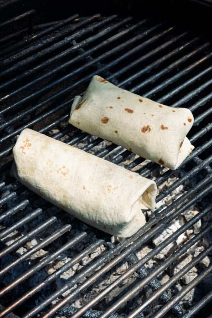 Caesar chicken wraps on the grill.