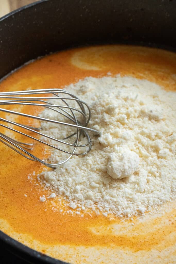 Sprinkled Parmesan Cheese in sauce.