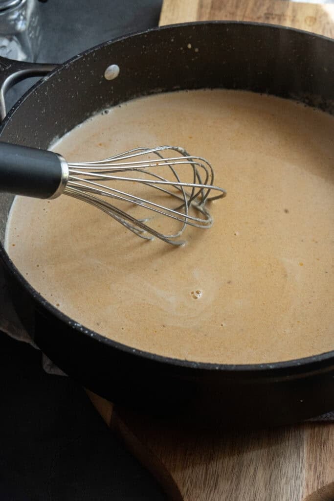 Mixing Cajun Shrimp Alfredo Sauce.