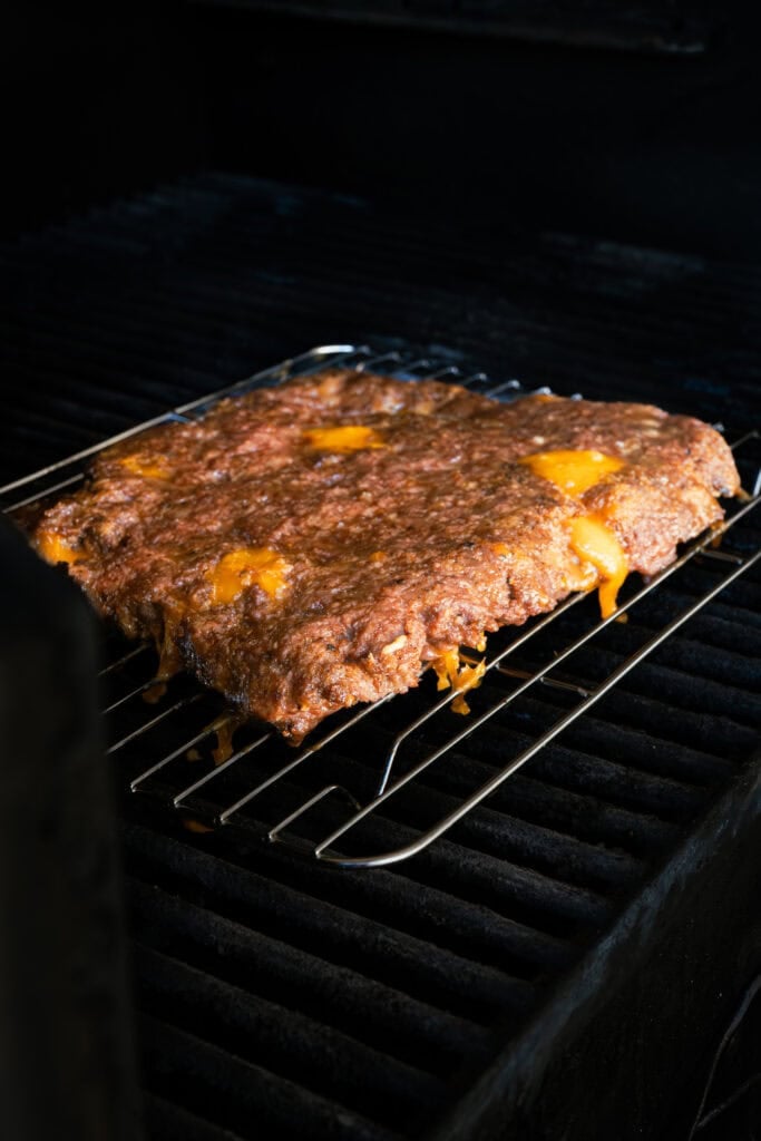 Beef on wire rack in smoker.