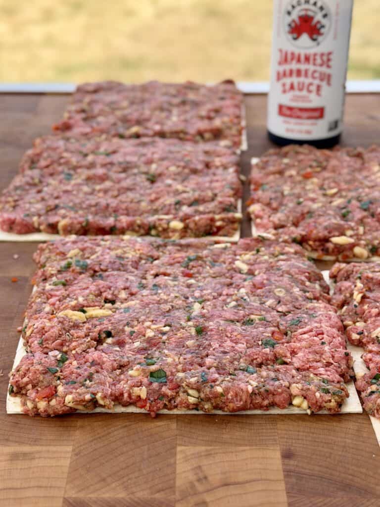 Spread meat on tortillas.