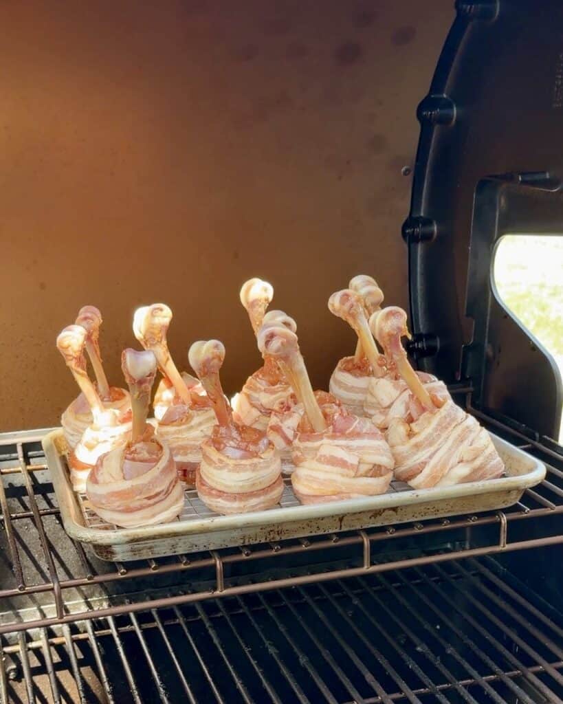 Chicken Legs on wire rack in smoker.