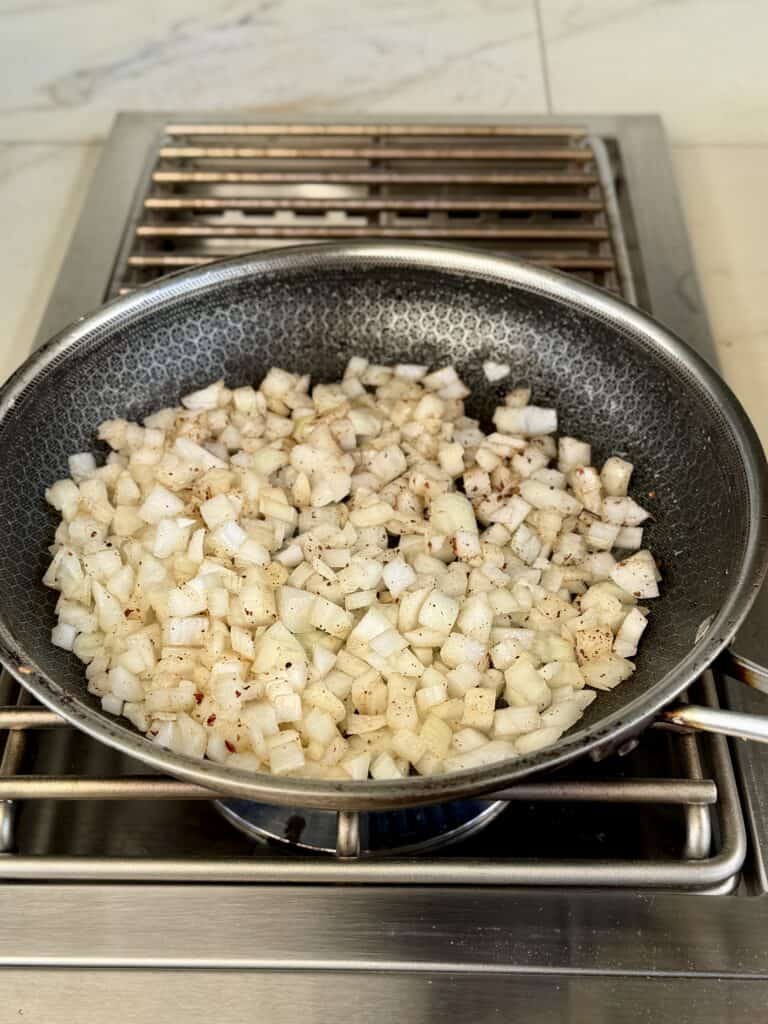 Fry onion in bacon grease.