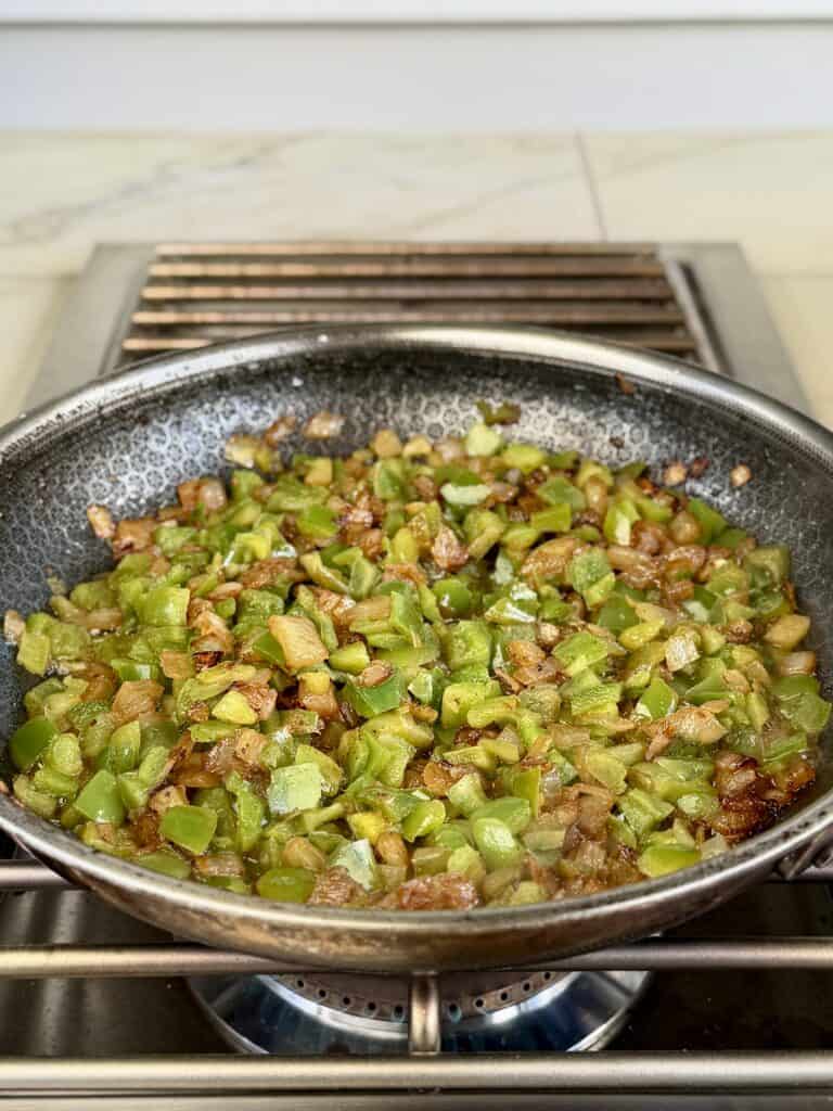 Add Green Pepper and fry in pan.