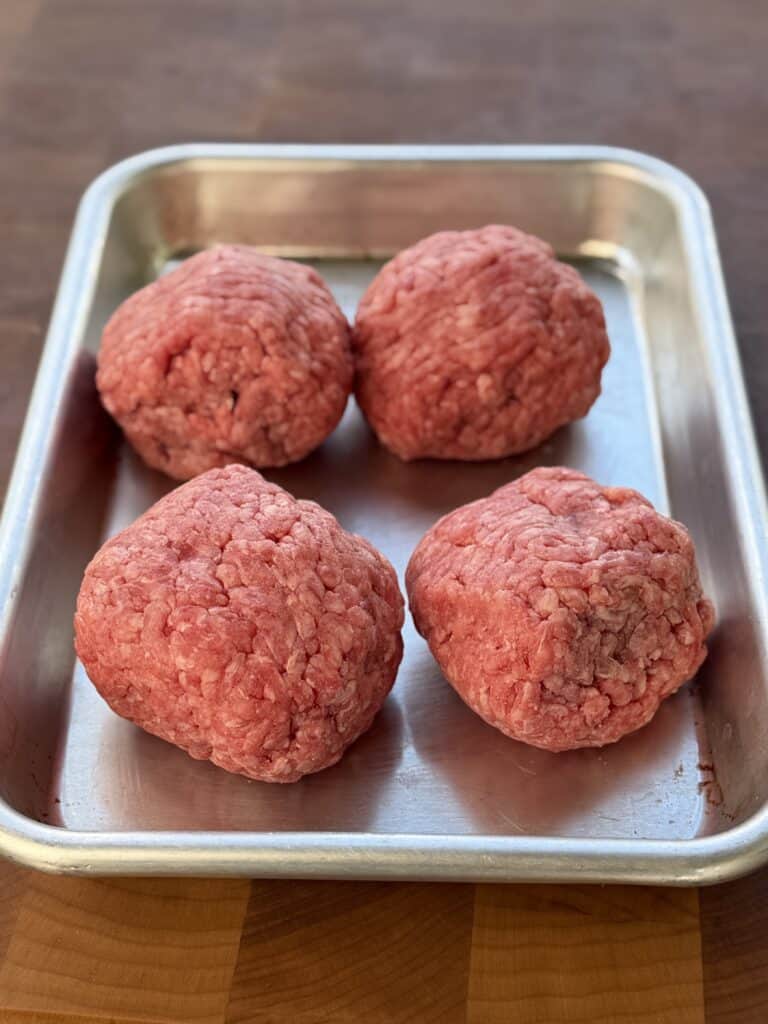 Form burger balls.