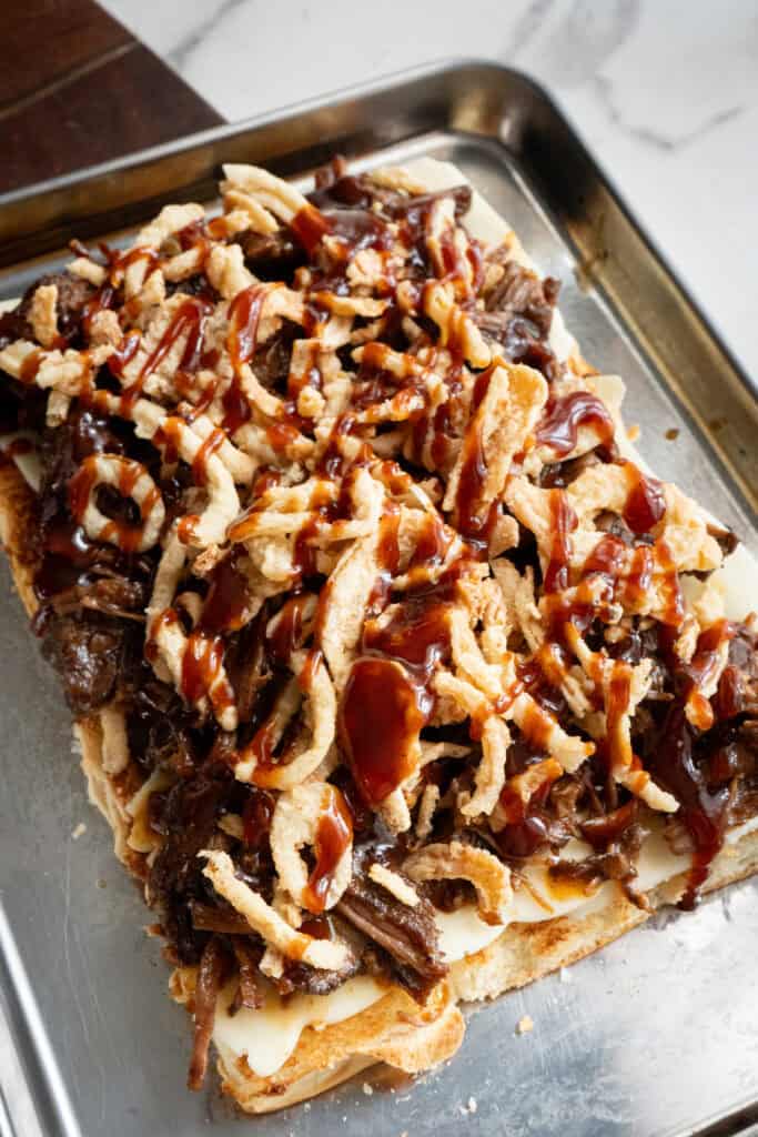 BBQ Sauce on top of onions and Beef.