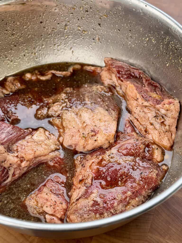 Steak marinating for Grilled Steak Caesar Salad Wrap.