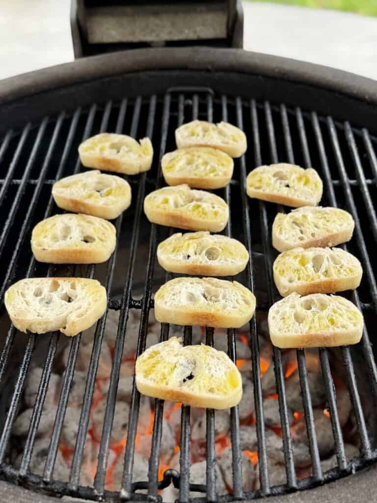Baguettes cooking on a grill.