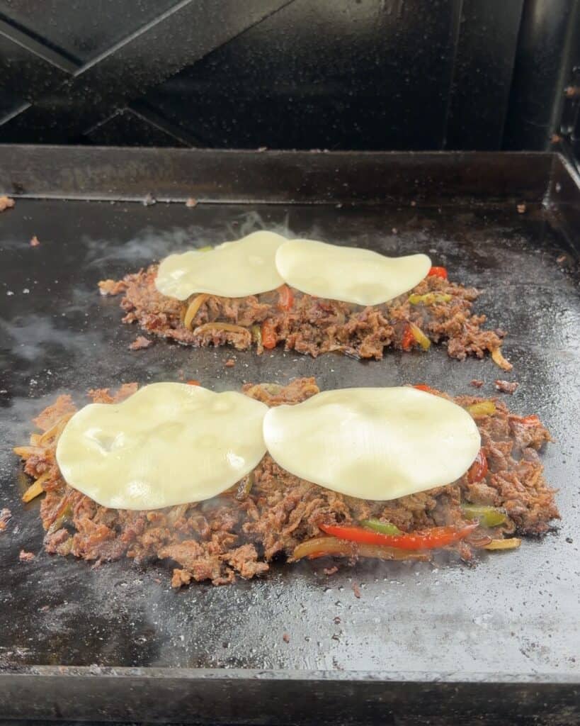 Place cheese on top of steak mixture.
