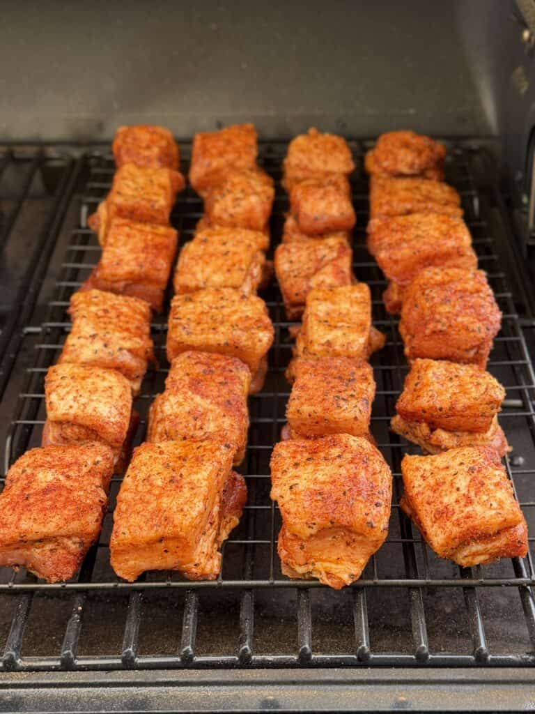 Place seasoned cubes on rack and in smoker.