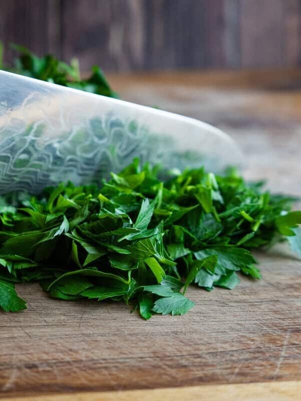 Chopped herbs with knife.