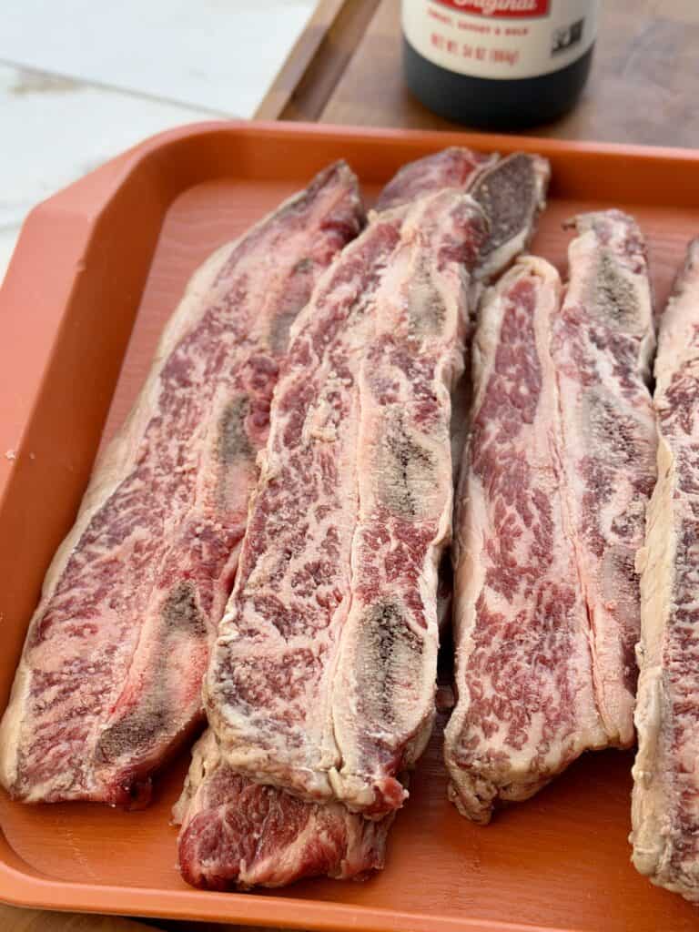 Uncooked Flanken Beef Short Ribs.