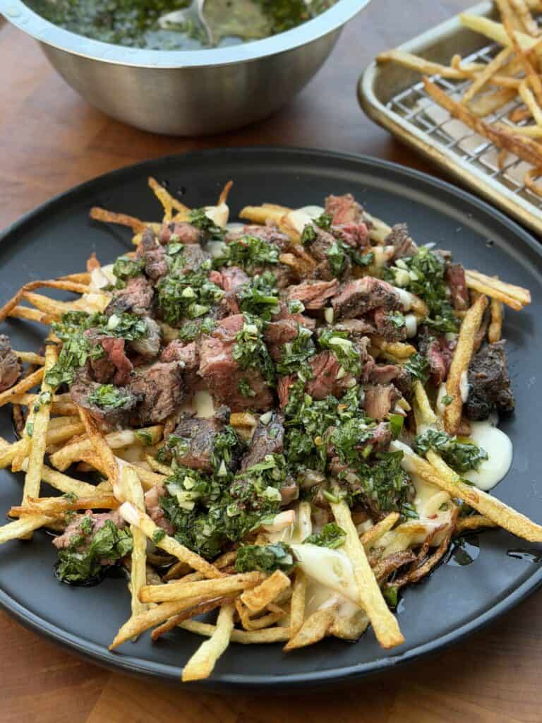 Grilled Steak Frites with Chimichurri on Plate.