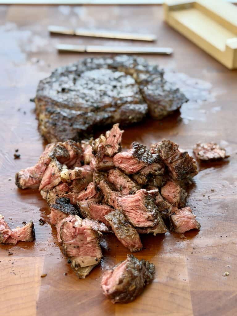 Ribeye Steak Cut on Cutting Board.