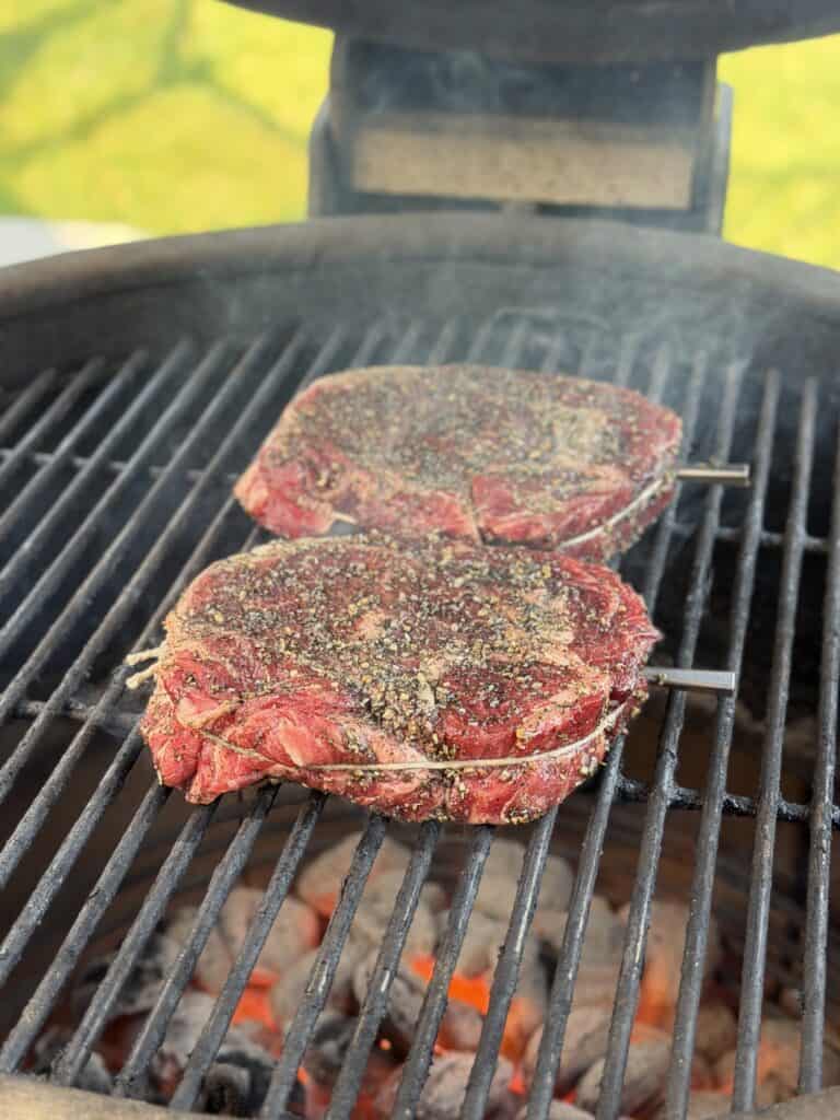 Grilled Steak Frites with Chimichurri
Seasoned Ribeye Steak on Grill.