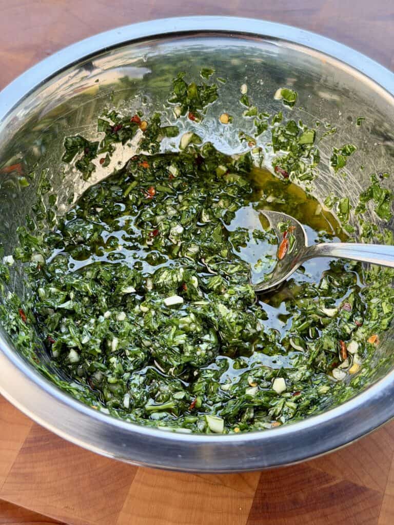 Grilled Steak Frites with Chimichurri
Sauce Mixed in Bowl.