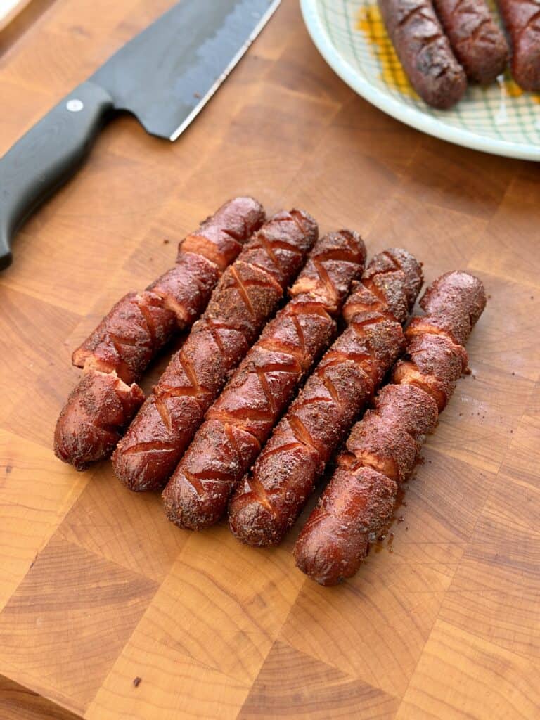 Cooked Hot Dogs on Cutting Board.
