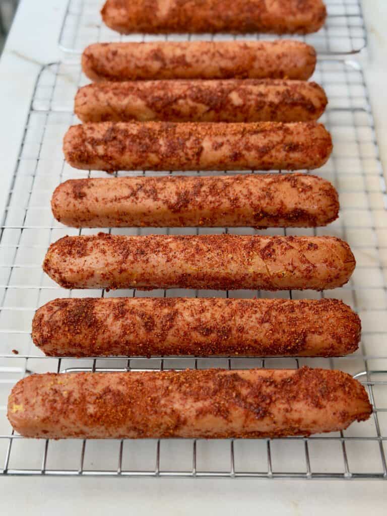 Seasoned Hot Dogs on Rack.