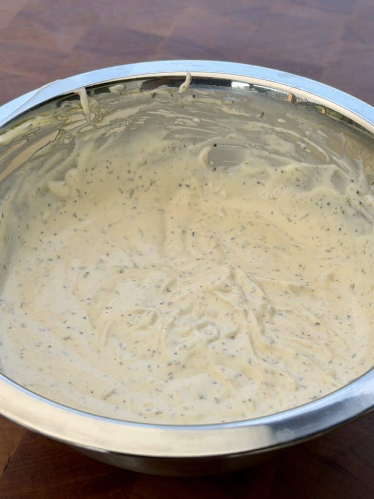 Italian Grinder Tortellini 
dressing mixed in bowl.